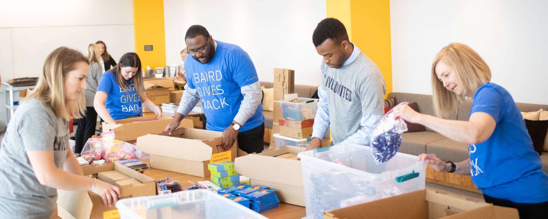 Group of Silver LakeAssociates packing food boxes.