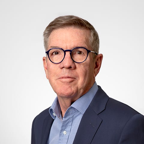 Pat Lawton professional headshot with gray background.